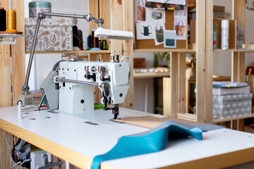Wall with sewing tools in designer atelier, workshop of tailor