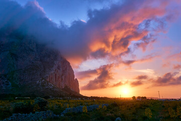 glorious sunset with huge clouds near San Vito lo Capo in Sicily