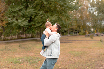 Fototapeta premium Father and daughter time playing outdoor in park and embracing.