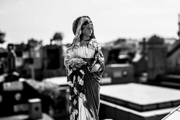 statue of Holy Mary on the cemetery