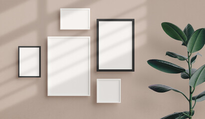 Various sizes of minimal photo frames mockup hanging on the apartment wall. Modern home interior design, blank empty frame template, nordic style