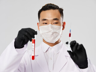 Asian male protective mask syringe with blood tests