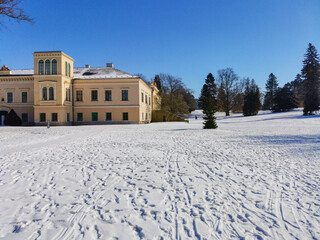 Empire Chateau with Museum of painter Josef Manes. Park and Castle Cechy pod Kosirem, Moravia, Czech during winter, covered with snow.