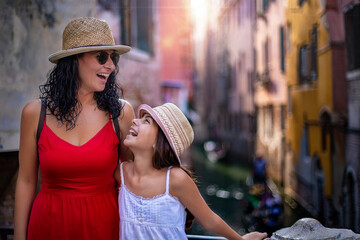 Tourist family members on the canal at Venice Italy