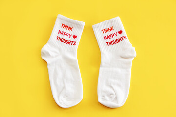 Antalya, Turkey, January 30, 2021. White sports cotton socks on a yellow background