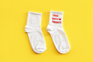 Antalya, Turkey, January 30, 2021. White sports cotton socks on a yellow background