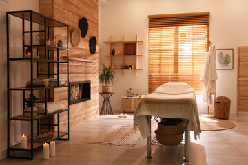 Stylish massage room interior in spa salon - obrazy, fototapety, plakaty