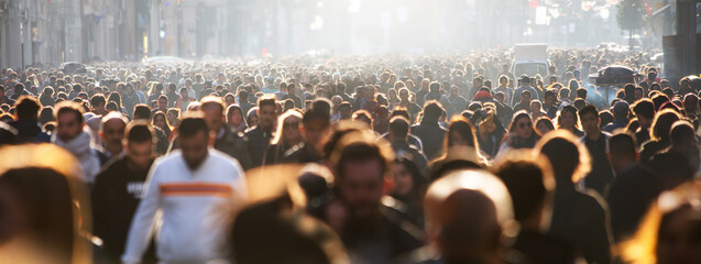 Blurred crowd of unrecognizable at the street - 414395208
