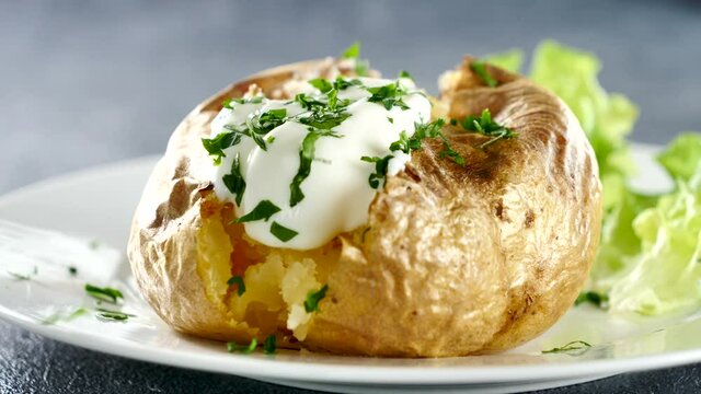 baked garnish potato with cream and parsley