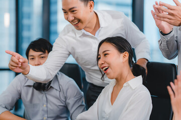 Millennial group of young businesspeople Asia businessman and businesswoman celebrate giving five...