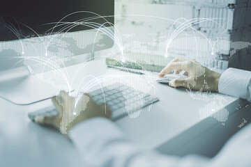 Double exposure of abstract digital world map with connections and hands typing on laptop on background, research and strategy concept