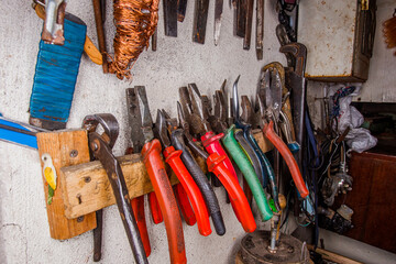 old vintage hand tool in on the wall in grandpa's workshop