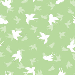 Seamless pattern with white swallow silhouette on green background. Cute bird in flight. Vector illustration. Doodle style. Design for invitation, poster, card, fabric, textile