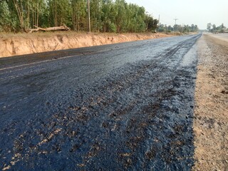 Tire spraying for road construction