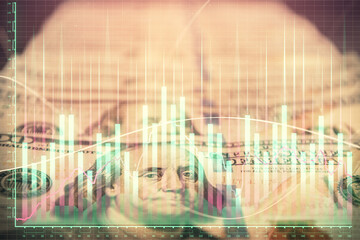 Double exposure of forex graph drawing over us dollars bill background. Concept of financial markets.