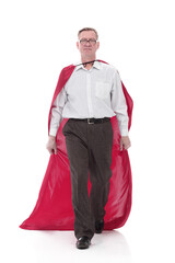 Fototapeta premium in full growth. Mature man in a superhero Cape striding forward.
