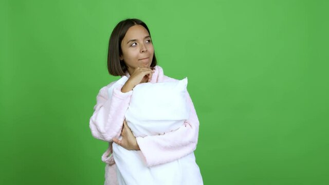 Woman in pajamas having doubts and questioning an idea over isolated background