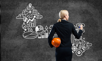 Businesswoman draws various business infographics