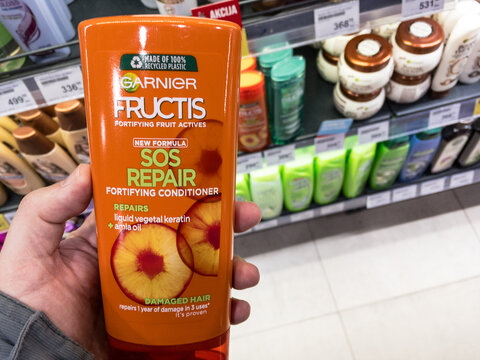 BELGRADE, SERBIA - FEBRUARY 8, 2021: Garnier fructics products, hair repair spray and shampoo conditioner for sale. Garnier is is a cosmetics and beauty hair care products brand part of l'Oreal