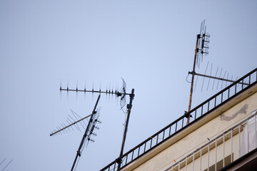 Television antennas,  VHF and UHF frequencies, at the top of a European roof. VHF and UHF are two of the main TV transmission and reception systems