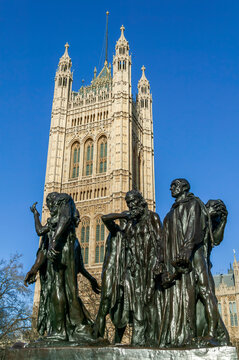 Burghers of Calais statue unveiled in 1915 in Victoria Tower Gardens at the Houses of Parliament  London England UK which is a popular tourist travel destination landmark, stock photo image