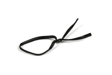 Black plastic coated wire tie used for a variety of things on white background.