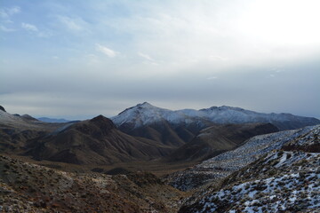 unpvaed road to the Red Passs at the Titus Canyon Road in the Amargosa Mountains, Death Valley National Park in winter with fresh snow
