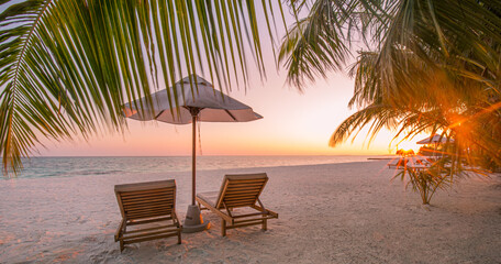 Beautiful beach. Chairs on the sandy beach near the sea. Summer holiday and vacation concept for tourism. Inspirational tropical landscape. Tranquil scenery, relaxing beach, tropical landscape design