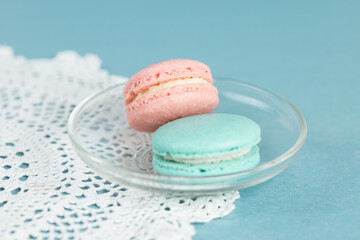 Colorful macarons on a blue background