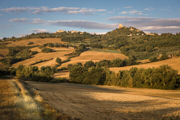 Fototapeta na wymiar Scenic view of of Tuscany hills with Rocca di Tetennano and Rocca Aldobrandesca, Siena, Italy
