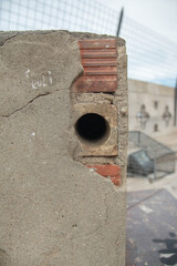 Wall hole, old cement and bricks, texture