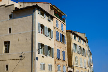  facade of provence style buiding in Marseille , France