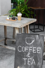 Coffee and tea sign  in front of coffee shop