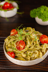 pasta with cherry tomatoes and greens beautiful serving plate