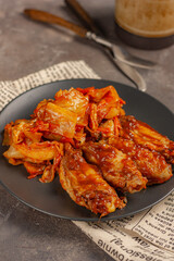 fast food chicken wings with stewed cabbage