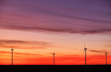 Fototapeta na wymiar Wind turbines at sunset landscape