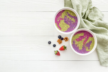 Smoothie bowles with chia seeds and strawberries, top view