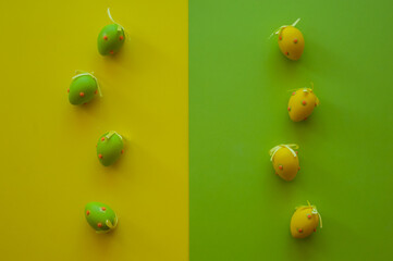 Easter colorful eggs on a colored background, top view.