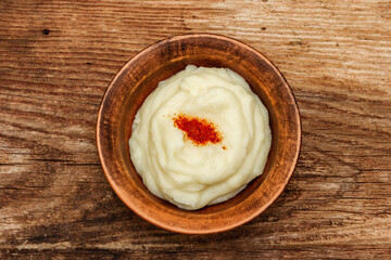 Mashed potato in antique ceramic bowl