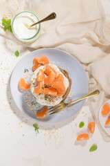 Pancakes with yogurt and tangerines