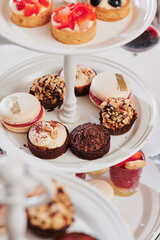 sweet catering. macarons and delicious desserts on the festive table. close-up