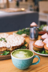 Matcha green tea latte in a cup. Top view. Copy space.