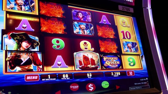 Close up woman playing slot machine inside the Casino with 4k resolution