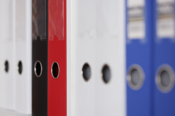 Closeup of many document folders in office. Working in archive concept