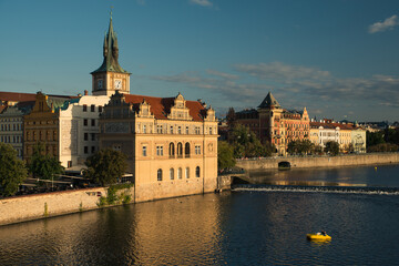 View on Bedrich Smetana Museum by vltava river bank in Prague in Czech Republic at golden hour.