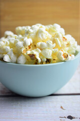 Closeup, popcorn in a bowl. Copy space.