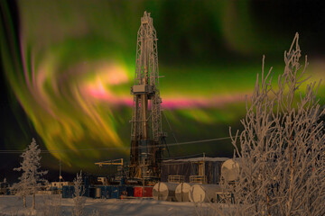 Polar night. Winter landscape with a drilling rig in the northern oil and gas field. In the...