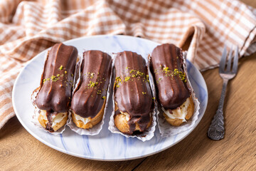 Traditional french eclairs with chocolate.