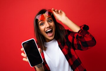 Photo of beautiful smiling surprised young woman good looking wearing casual stylish red shirt...