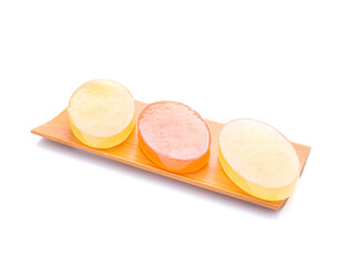 Organic soaps homemade with ingredients are honey placed on a bamboo plate with white background. Soap protection or prevent acne, bacteria in both body, and facial. Concept of healthcare